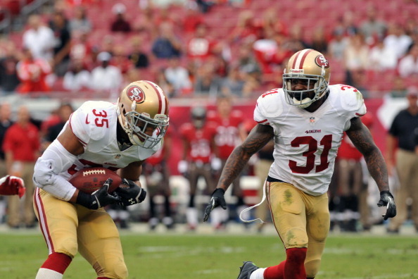 TAMPA, FL -  DECEMBER 15:  Safety Eric Reid #35 of the San Francisco 49ers intercepts a 4th-quarter pass against the Tampa Bay Buccaneers December 15, 2013 at Raymond James Stadium in Tampa, Florida. The 49ers won 33 - 14. (Photo by Al Messerschmidt/Getty