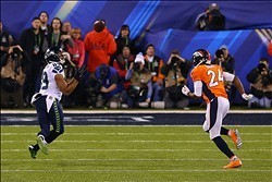 Feb 2, 2014; East Rutherford, NJ, USA; Seattle Seahawks wide receiver Doug Baldwin (89)] hauls in a pass as Denver Broncos cornerback Champ Bailey (24) closes in Super Bowl XLVIII at MetLife Stadium.  Mandatory Credit: Ed Mulholland-USA TODAY Sports