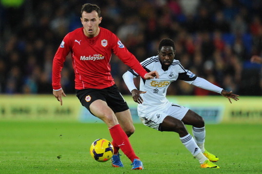 CARDIFF, WALES - NOVEMBER 03:  Swansea City player Nathan Dyer (r) challenges Cardiff player Jordon Mutch during the Barclays Premier League match between Cardiff City and Swansea at Cardiff City Stadium on November 3, 2013 in Cardiff, Wales.  (Photo by S