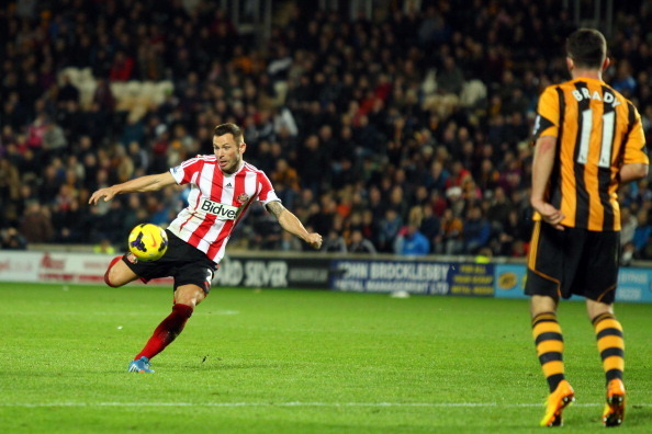 HULL, ENGLAND - NOVEMBER 02:  Sunderland's Phillip Bardsley volleys wide of the goal past Hull City's Robbie Brady during the Barclays Premier League match between Hull City and Sunderland at KC Stadium on November 02, 2013 in Hull, England.  (Photo by Ti