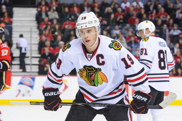 CALGARY, AB - JANUARY 28: Jonathan Toews #19 of the Chicago Blackhawks prepares for a faceoff against the Calgary Flames during an NHL game at Scotiabank Saddledome on January 28, 2014 in Calgary, Alberta, Canada. (Photo by Derek Leung/Getty Images)