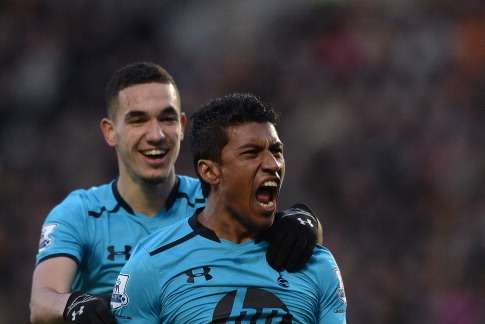 HULL, ENGLAND - FEBRUARY 01:  Paulinho of Tottenham Hotspur celebrates scoring a goal with team-mate Nabil Bentaleb during the Barclays Premier League match between Hull City and Tottenham Hotspur at KC Stadium on February 1, 2014 in Hull, England.  (Phot