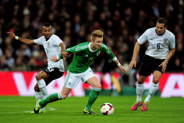 LONDON, ENGLAND - NOVEMBER 19:  Marco Reus of Germany takes on Ashley Cole of England during the international friendly match between England and Germany at Wembley Stadium on November 19, 2013 in London, England.  (Photo by Shaun Botterill/Getty Images)