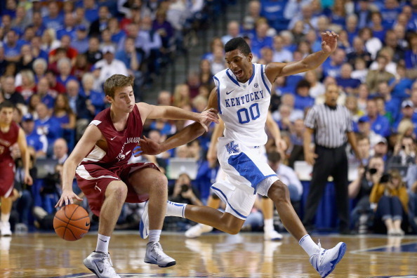 LEXINGTON, KY - NOVEMBER 01:  Marcus Lee #00 of the Kentucky Wildcats defends Logan Wade #22 of the Transylvania Pioneers during the exhibition game at Rupp Arena on November 1, 2013 in Lexington, Kentucky.  (Photo by Andy Lyons/Getty Images)
