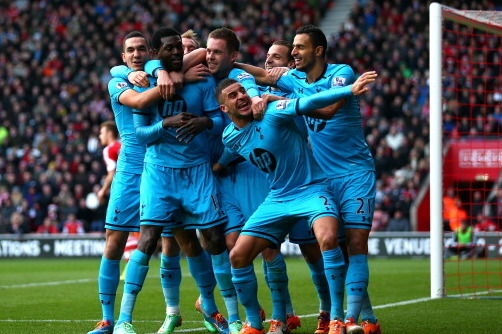 SOUTHAMPTON, ENGLAND - DECEMBER 22:  Emmanuel  Adebayor (2nd L) of Spurs celebrates with teammates after scoring his team's third goal during the Barclays Premier League match between Southampton and Tottenham Hotspur at St Mary's Stadium on December 22, 