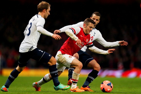 LONDON, ENGLAND - JANUARY 04:  Jack Wilshere of Arsenal is pursued by Christian Eriksen and Roberto Soldado of  Spurs during the Budweiser FA Cup third round match between Arsenal and Tottenham Hotspur at Emirates Stadium on January 4, 2014 in London, Eng