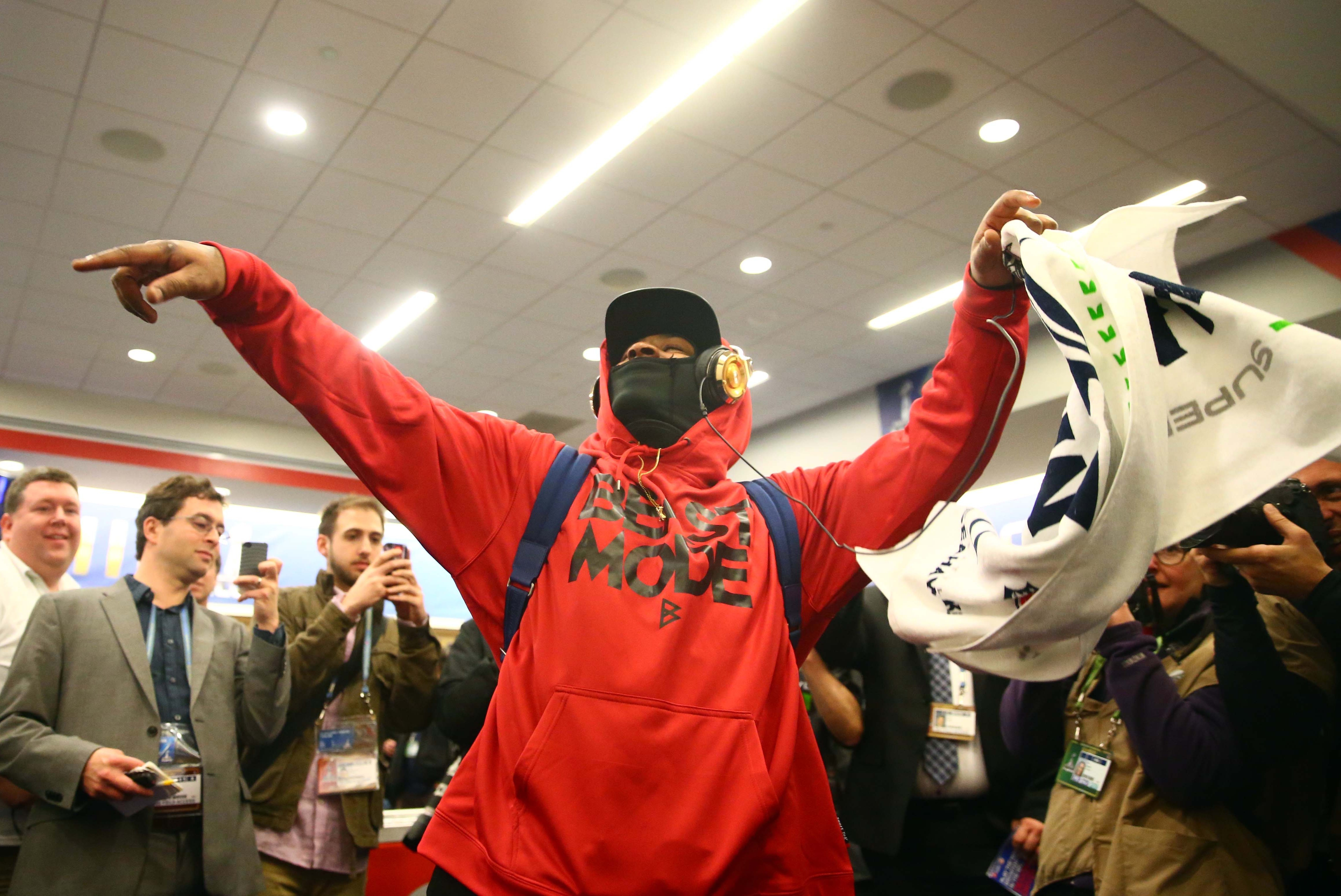 Feb 2, 2014; East Rutherford, NJ, USA; Seattle Seahawks running back Marshawn Lynch celebrates in the locker room after Super Bowl XLVIII against the Denver Broncos at MetLife Stadium.  Mandatory Credit: Mark J. Rebilas-USA TODAY Sports
