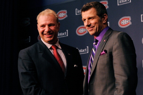 BROSSARD, CANADA - JUNE 5:  Montreal Canadiens Head Coach Michel Therrien and General Manager Marc Bergevin shake hands and pose for photos after Therrien was introduced as the Montreal Canadiens new Head Coach at the Bell SportsPlex on June 5, 2012 in Br