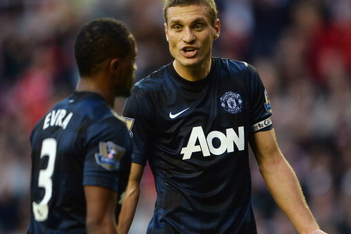 SUNDERLAND, ENGLAND - OCTOBER 05: Nemanja Vidic of Manchester United gestures to Patrice Evra of Manchester United during the Barclays Premier League match between Sunderland and Manchester United at the Stadium of Light on October 5, 2013 in Sunderland, 