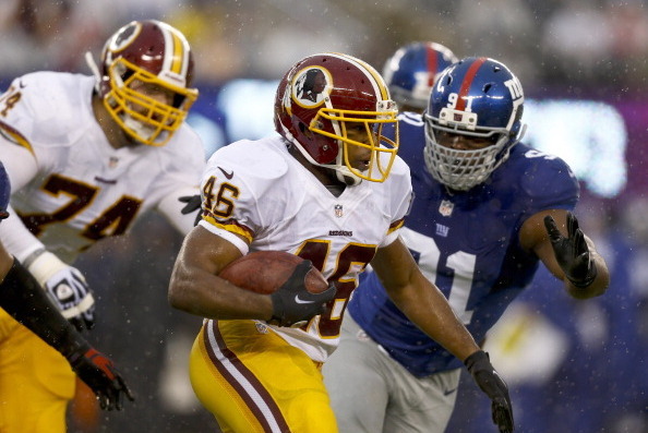 EAST RUTHERFORD, NJ - DECEMBER 29:   Alfred Morris #46 of the Washington Redskins runs the ball by Justin Tuck #91 of the New York Giants during their game at MetLife Stadium on December 29, 2013 in East Rutherford, New Jersey.  (Photo by Jeff Zelevansky/