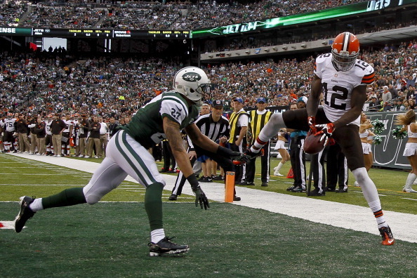 EAST RUTHERFORD, NJ - DECEMBER 22:   Josh Gordon #12 of the Cleveland Browns tries to catch a pass in front of Dee Milliner #27 of the New York Jets during their game at MetLife Stadium on December 22, 2013 in East Rutherford, New Jersey.  (Photo by Jeff 
