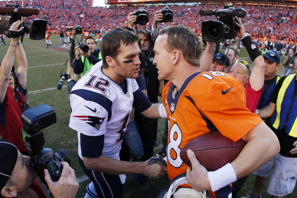 DENVER, CO - JANUARY 19:  Tom Brady #12 of the New England Patriots congratulates  Peyton Manning #18 of the Denver Broncos after the Broncos defeated the Patriots 26 to 16 during the AFC Championship game at Sports Authority Field at Mile High on January