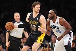 January 31, 2014; Los Angeles, CA, USA; Los Angeles Lakers center Pau Gasol (16) moves the ball against the defense of Charlotte Bobcats center Al Jefferson (25) during the first half at Staples Center. Mandatory Credit: Gary A. Vasquez-USA TODAY Sports