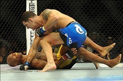 Jul 6, 2013; Las Vegas, NV, USA;  Chris Weidman, blue shorts, defeated Anderson Silva (yellow shorts) in their Middleweight Chamionship Bout in the second round with a TKO at the MGM Grand Garden Arena. Mandatory Credit: Jayne Kamin-Oncea-USA TODAY Sports