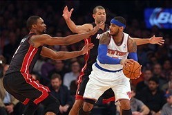 Feb 1, 2014; New York, NY, USA; New York Knicks small forward Carmelo Anthony (7) is defended by Miami Heat center Chris Bosh (1) and small forward Shane Battier (31) during the first period of a game at Madison Square Garden. Mandatory Credit: Brad Penne