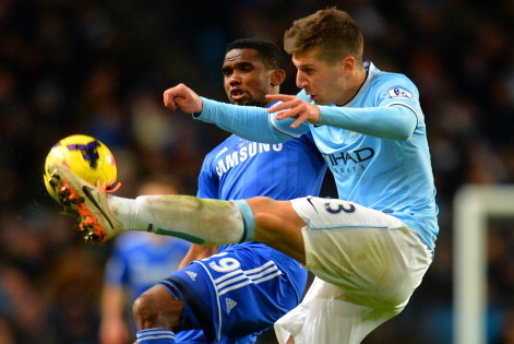 MANCHESTER, ENGLAND - FEBRUARY 03: Samuel Eto'o of Chelsea and Matija Nastasic of Manchester City battle for the ball during the Barclays Premier League match between Manchester City and Chelsea at Etihad Stadium on February 3, 2014 in Manchester, England