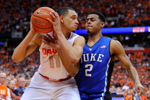 SYRACUSE, NY - FEBRUARY 01:  Quinn Cook #2 of the Duke Blue Devils defends against Tyler Ennis #11 of the Syracuse Orange during overtime at the Carrier Dome on February 1, 2014 in Syracuse, New York.  Syracuse defeated Duke 91-89 in overtime.  (Photo by 