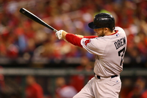 ST LOUIS, MO - OCTOBER 27:  Stephen Drew #7 of the Boston Red Sox hits a sacrifice fly to left field against Lance Lynn #31 of the St. Louis Cardinals in the fifth inning during Game Four of the 2013 World Series at Busch Stadium on October 27, 2013 in St