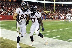 Dec 1, 2013; Kansas City, MO, USA; Denver Broncos wide receiver Eric Decker (87) celebrates with running back Knowshon Moreno (27) after catching a touchdown pass against Kansas City Chiefs in the second half at Arrowhead Stadium. Denver won the game 35-2