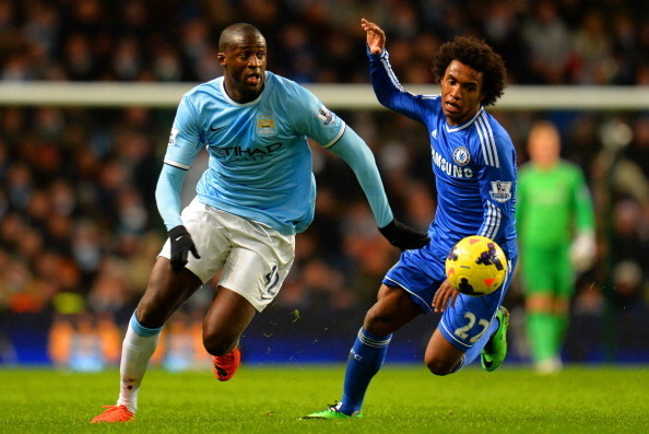 MANCHESTER, ENGLAND - FEBRUARY 03:  Willian of Chelsea marshalls Yaya Toure of Manchester City during the Barclays Premier League match between Manchester City and Chelsea at Etihad Stadium on February 3, 2014 in Manchester, England.  (Photo by Shaun Bott