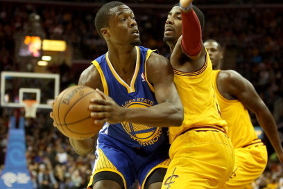CLEVELAND, OH - DECEMBER 29: Harrison Barnes #40 of the Golden State Warriors handles the ball against Kyrie Irving #2 of the Cleveland Cavaliers in the first quarter at Quicken Loans Arena on December 29, 2013 in Cleveland, Ohio. NOTE TO USER: User expre