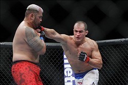 May 25, 2013; Las Vegas, NV, USA; Junior dos Santos lands a punch against Mark Hunt during UFC 160 at the MGM Grand Garden Arena. Mandatory Credit: Gary A. Vasquez-USA TODAY Sports