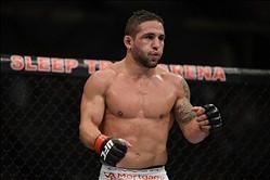 December 14, 2013; Sacramento, CA, USA; Chad Mendes (red gloves) fights Nik Lentz (blue gloves) during the featherweight bout of the UFC on FOX 9 at Sleep Train Arena. Mendes defeated Lentz. Mandatory Credit: Kyle Terada-USA TODAY Sports