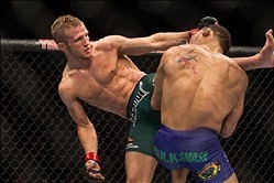 Jan 15, 2014; Duluth, GA, USA; TJ Dilleshaw (red gloves) fights Mike Easton (right) during UFC Fight Night at Gwinnett Center. Dillashaw won. Mandatory Credit: Joshua S. Kelly-USA TODAY Sports