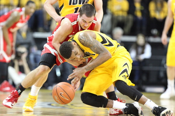 IOWA CITY, IA - FEBRUARY 04:  Guard Roy Devyn Marble #4 of the Iowa Hawkeyes battles for a loose ball during the first half against guard Aaron Craft #4 of the Ohio State Buckeyes on February 4, 2014 at Carver-Hawkeye Arena, in Iowa City, Iowa. (Photo by 