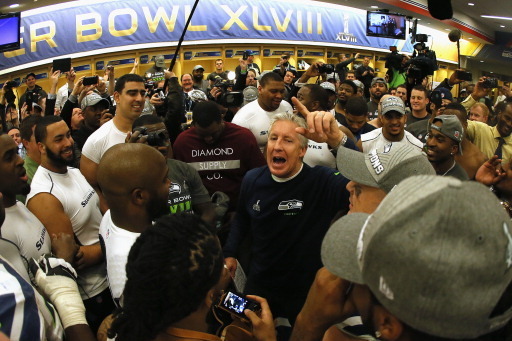 EAST RUTHERFORD, NJ - FEBRUARY 02:  Head coach Pete Carroll of the Seattle Seahawks gives his team a speech in the locker room after the Seahawks 43-8 victory during Super Bowl XLVIII at MetLife Stadium on February 2, 2014 in East Rutherford, New Jersey. 