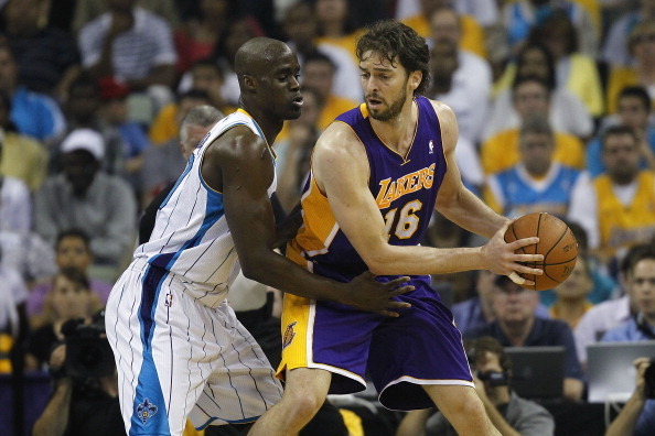 NEW ORLEANS, LA - APRIL 24:  Emeka Okafor #50 of the New Orleans Hornets guards Pau Gasol #16 of the Los Angeles Lakers in Game Four of the Western Conference Quarterfinals in the 2011 NBA Playoffs at New Orleans Arena on April 24, 2011 in New Orleans, Lo