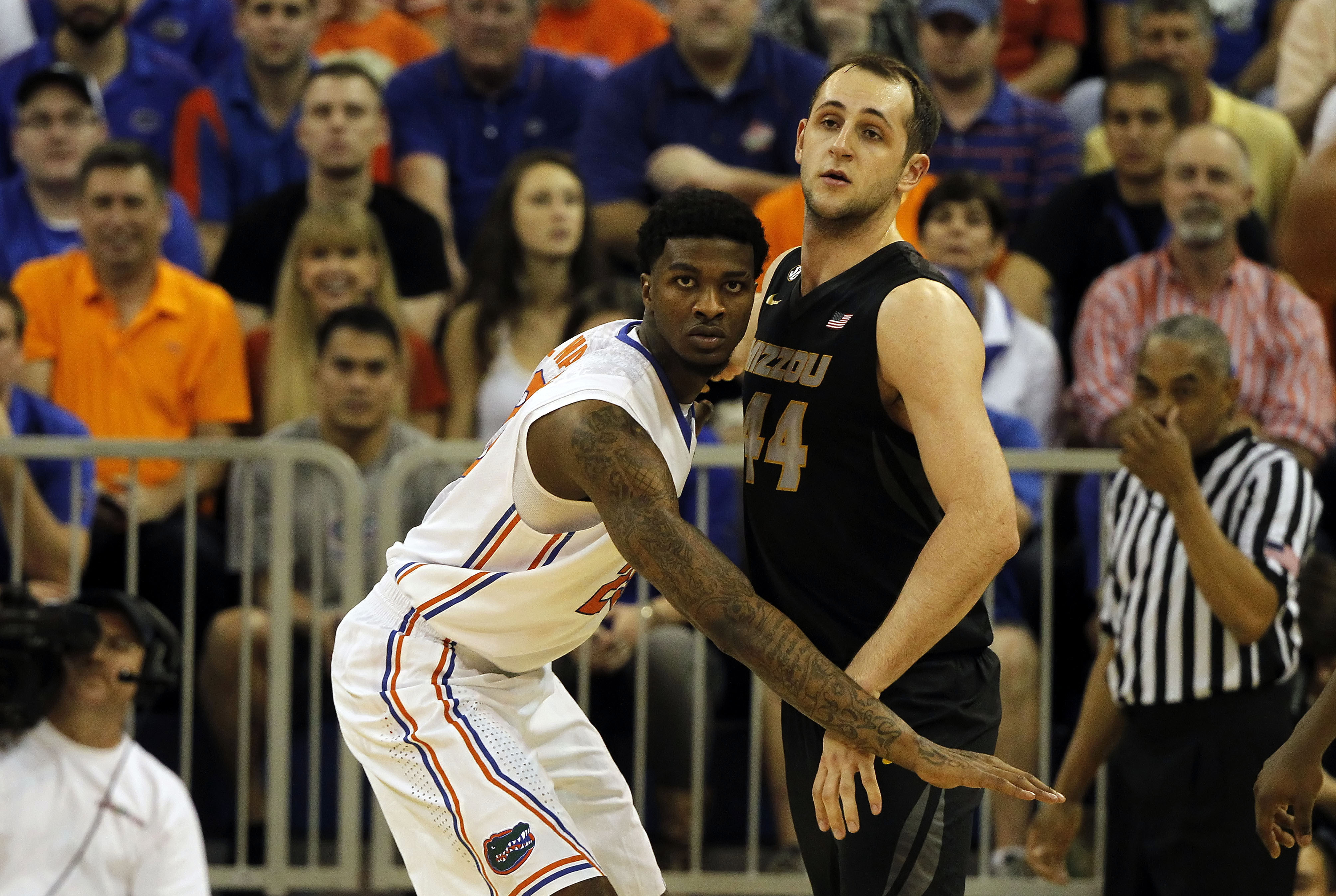 Feb 4, 2014; Gainesville, FL, USA; Florida Gators forward Chris Walker (23) defends Missouri Tigers forward Ryan Rosburg (44) during the first half at Stephen C. O'Connell Center. Mandatory Credit: Kim Klement-USA TODAY Sports