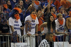 Jan 14, 2014; Gainesville, FL, USA; Florida Gators fans in the student section, Rowdy Reptiles, wear shirts that say