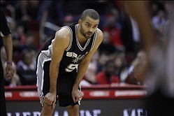 /Jan 28, 2014; Houston, TX, USA; San Antonio Spurs point guard Tony Parker (9) with his hands on his knees during the fourth quarter against the Houston Rockets at Toyota Center. Mandatory Credit: Andrew Richardson-USA TODAY Sports
