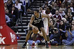 Jan 28, 2014; Houston, TX, USA; San Antonio Spurs power forward Boris Diaw (33) is defended by Houston Rockets point guard Patrick Beverley (2) during the third quarter at Toyota Center. Mandatory Credit: Andrew Richardson-USA TODAY Sports