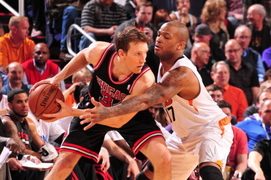 PHOENIX, AZ - FEBRUARY 4: Mike Dunleavy #34 of the Chicago Bulls is guarded by P.J. Tucker #17 of the Phoenix Suns on February 4, 2014 at U.S. Airways Center in Phoenix, Arizona. NOTE TO USER: User expressly acknowledges and agrees that, by downloading an