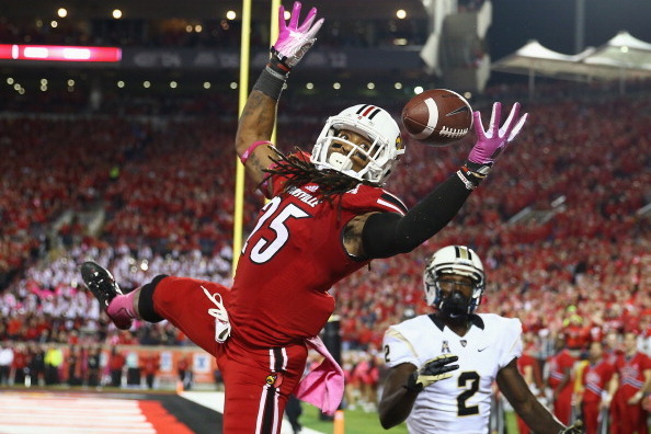 LOUISVILLE, KY - OCTOBER 18:  Calvin Pryor #25 of the Louisville Cardinals intercepts a pass in the end zone during the game against the Central Florida Knights at Papa John's Cardinal Stadium on October 18, 2013 in Louisville, Kentucky.  (Photo by Andy L