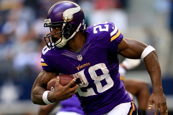 ARLINGTON, TX - NOVEMBER 03:  Running back Adrian Peterson #28 of the Minnesota Vikings carries the ball during the game against the Dallas Cowboys at Cowboys Stadium on November 3, 2013 in Arlington, Texas.  (Photo by Jamie Squire/Getty Images)