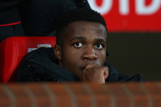 MANCHESTER, ENGLAND - JANUARY 05:  Wilfried Zaha of Manchester United looks on from the bench prior to the FA Cup with Budweiser Third round match between Manchester United and Swansea City at Old Trafford on January 5, 2014 in Manchester, England.  (Phot