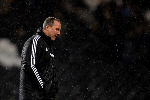 LONDON, ENGLAND - FEBRUARY 04:  A deejcted Manager Rene Meulensteen of Fulham walks on the pitch after defeat during the FA Cup Fourth Round Replay match between Fulham and Sheffield United at Craven Cottage on February 4, 2014 in London, England.  (Photo