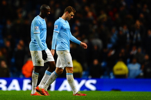 MANCHESTER, ENGLAND - FEBRUARY 03:  A dejected Yaya Toure of Manchester City and Edin Dzeko of Manchester City leave the field at the final whistle during the Barclays Premier League match between Manchester City and Chelsea at Etihad Stadium on February 