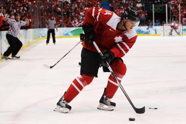 VANCOUVER, BC - FEBRUARY 18:  Roman Wick of Switzerland handles the puck during the ice hockey men's preliminary game between Switzerland and Canada on day 7 of the 2010 Winter Olympics at Canada Hockey Place on February 18, 2010 in Vancouver, Canada.  (P