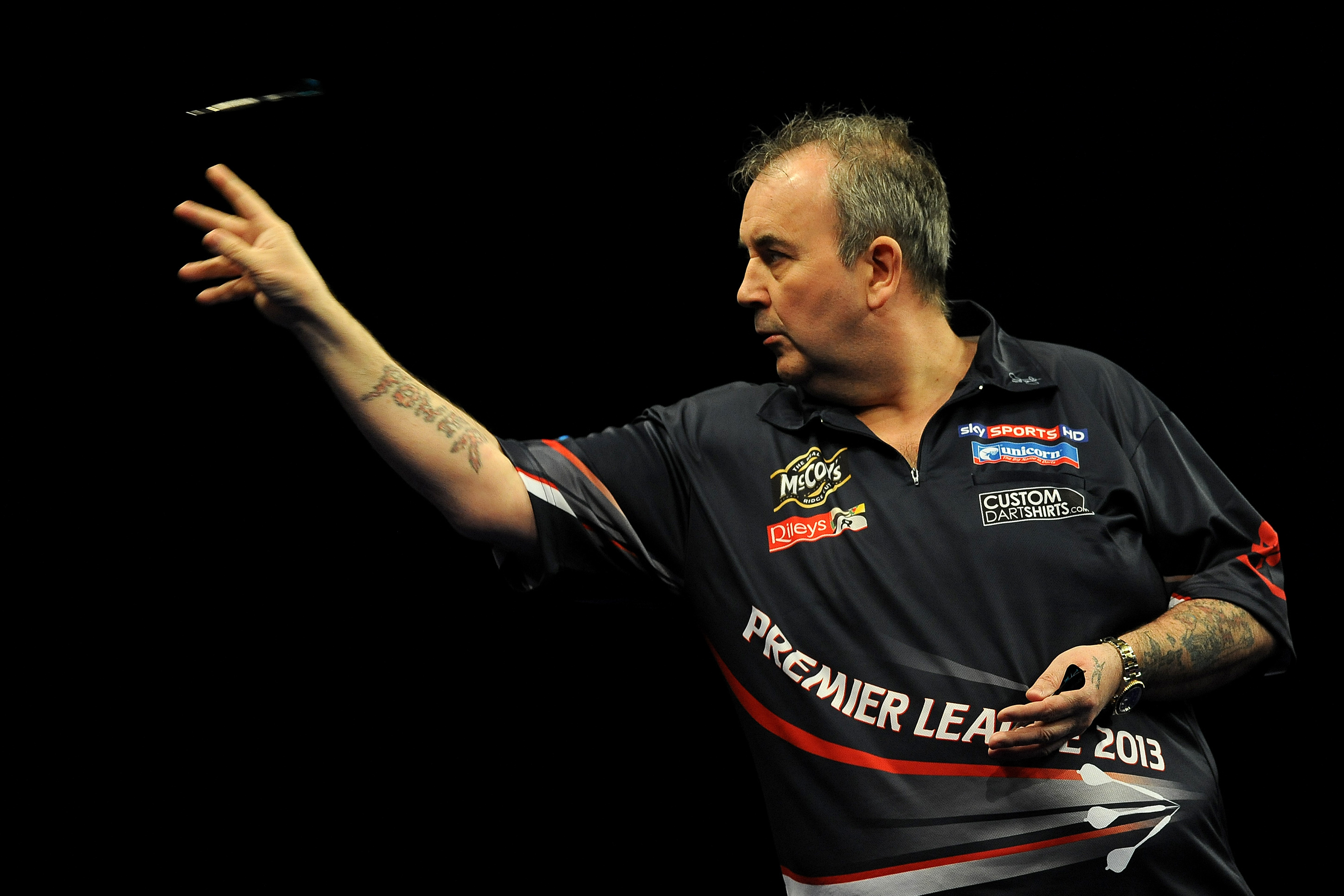 LONDON, ENGLAND - MAY 16: Phill Taylor of England in action during his semi final match against Raymond Van Barneveld of Holland during the McCoy's Premier League Darts Play-Offs at The O2 Arena on May 16, 2013 in London, England. (Photo by Charlie Crowhu