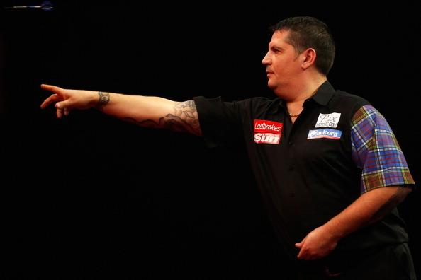 LONDON, ENGLAND - DECEMBER 28: Gary Anderson of Scotland in action during his third round match against Michael van Gerwen of Holland on day thirteen of the Ladbrokes.com World Darts Championship at Alexandra Palace on December 28, 2013 in London, England