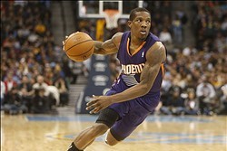 Dec 20, 2013; Denver, CO, USA; Phoenix Suns guard Eric Bledsoe (2) dribbles the ball during the first half against the Denver Nuggets at Pepsi Center. Mandatory Credit: Chris Humphreys-USA TODAY Sports