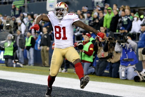 SEATTLE, WA - JANUARY 19:  Wide receiver Anquan Boldin #81 of the San Francisco 49ers celebrates after making a 26-yard touchdown catch against the Seattle Seahawks in the third quarter during the 2014 NFC Championship at CenturyLink Field on January 19, 