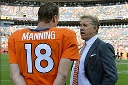 September 30 2012; Denver, CO, USA;  Denver Broncos quarterback Peyton Manning (18) and executive vice president of football operations John Elway talk near the end of the game against the Oakland Raiders at Sports Authority Field. The Broncos defeated th