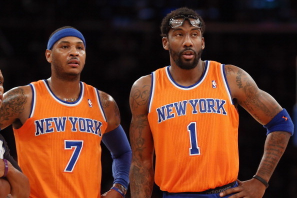 NEW YORK, NY - DECEMBER 08: Carmelo Anthony #7 and Amar'e Stoudemire #1 of the New York Knicks wait for play to resume during the second quarter against the Boston Celtics at Madison Square Garden on December 8, 2013 in New York City. NOTE TO USER: User e