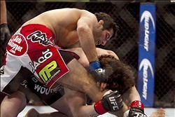Jan 15, 2014; Duluth, GA, USA; Beneil Dariush (blue gloves) fights Charlie Brenneman (red gloves) during UFC Fight Night at Gwinnett Center. Dariush won. Mandatory Credit: Joshua S. Kelly-USA TODAY Sports