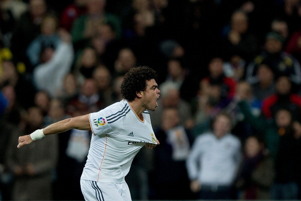 MADRID, SPAIN - FEBRUARY 05:  Pepe of Real Madrid CF celebrates scoring their opening goal during the Copa del Rey semifinal first leg match between Real Madrid CF and Club Atletico Madrid at Estadio Santiago Bernabeu on February 5, 2014 in Madrid, Spain.